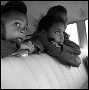 Primary view of object titled '[Children Leaning Over the Backseat of a Car]'.