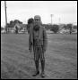 Photograph: [A Boy Wearing a Costume in a Field]