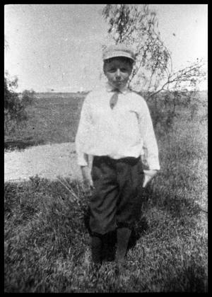 Primary view of object titled '[Boy Standing in Rangeland]'.