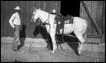 Photograph: [Two Men and a Horse in Front of a Barn]