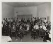 Photograph: [Photograph of a Crowd at a Community Meeting]