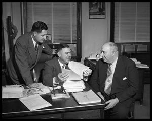 Primary view of object titled '[Three Men at Desk]'.
