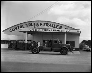 Primary view of object titled 'Truck parked in front of Capitol Truck & Trailer Co.'.