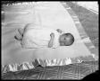 Photograph: [Baby Lying on Blanket]