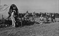 Photograph: [Albert Peyton George with ranch cowboys taking a break]