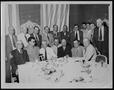 Photograph: [Albert Peyton George with seventeen men at a hotel dinner table]