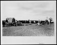 Primary view of [Albert Peyton George with ranch cowboys taking a break at the chuck wagon]