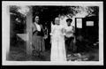 Photograph: [Belle Ryon Davis with a woman to her right and a young man to her le…