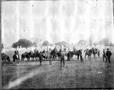 Photograph: [Photograph of fourteen men mounted on horses]
