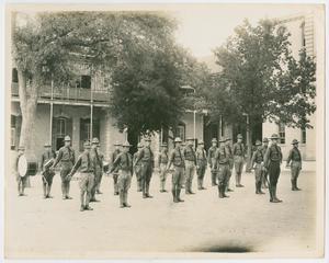 Primary view of object titled '[Men Stand in Formation]'.