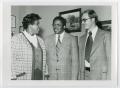 Photograph: Barbara Jordan, Fred D. Gray, and Darryl Hardin Meeting in an Office]