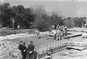 Primary view of object titled '[Group of Construction Workers Laying the Foundation of Shelton Chapel]'.