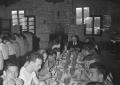Photograph: [People Eating at the Austin Seminary picnic at the Zilker Park Clubh…