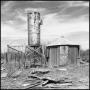 Photograph: [Photograph of Abandoned Structures]