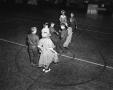 Photograph: [Eight Children Square Dancing in a Gymnasium]