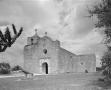 Photograph: [Exterior View of a Mission Church and a Cannon]