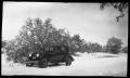 Photograph: [Photograph of Dark Automobile in Snow]