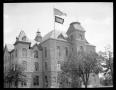 Photograph: [HPC Administration Building with Flags]