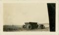 Photograph: [Tractor Pulling Dirt-Hauling Trailer]