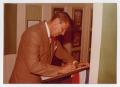 Photograph: [Photograph of Ronald Reagan Writing]