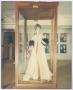 Photograph: [Photograph of Mannequin Wearing Long Coat in Exhibit]