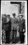 Photograph: [Three men wearing suits and hats, outside of a building]
