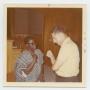 Photograph: [Photograph of Ben Adenuusi Talking With Cyril Poindexter]
