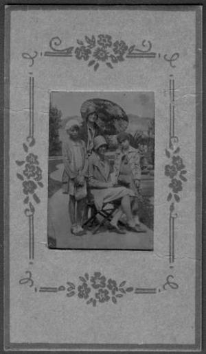 Primary view of object titled '[Four young women posed in an outdoor setting]'.