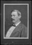 Photograph: [F. I. Booth wearing a dark colored jacket and a white striped shirt]