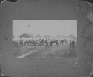 Primary view of object titled '[A group of men on horseback, a few men are standing]'.