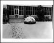 Photograph: [Front screened porch of the George Ranch house covered in snow]