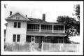 Photograph: [The George Ranch house with the fence gate open]