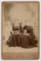 Photograph: [Photograph of an Older Woman with Two Girls]