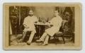 Photograph: [Photograph of Two Men at a Table]