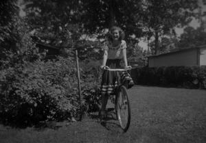 Primary view of object titled '[Woman on Bike]'.