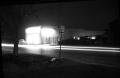 Primary view of [Carl McCaslin Lumber Company at Night]
