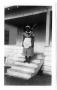 Photograph: [Unidentified Woman on Steps of Freeport Rectory]